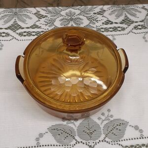 vintage jeanette candy dish amber glass with etched grape vine on lid.
